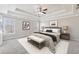 Serene primary bedroom offers a tray ceiling, plush carpeting, and a relaxing atmosphere at 5034 Hickory Hills Dr, Woodstock, GA 30188