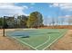 Community sport court with basketball hoop and volleyball net, providing recreational opportunities at 5034 Hickory Hills Dr, Woodstock, GA 30188