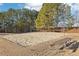 Outdoor sand volleyball court, perfect for active recreation, with a picnic table for players to rest at 5034 Hickory Hills Dr, Woodstock, GA 30188