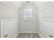 Large walk-in closet features adjustable shelving and access to attic space at 5034 Hickory Hills Dr, Woodstock, GA 30188