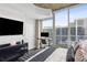 Modern bedroom featuring a workspace, large windows, and stylish decor offers a comfortable retreat at 855 Peachtree Ne St # 3005, Atlanta, GA 30308