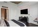 Cozy bedroom with hardwood floors, a large TV, and modern decor offers a relaxing and stylish ambiance at 855 Peachtree Ne St # 3005, Atlanta, GA 30308