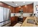 Beautiful kitchen featuring granite countertops, stainless steel appliances, and ample cabinet space at 855 Peachtree Ne St # 3005, Atlanta, GA 30308