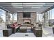Outdoor fireplace featuring comfortable seating, a TV, and condominium views at 855 Peachtree Ne St # 3005, Atlanta, GA 30308
