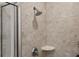 Close up of the shower with neutral tiles and modern showerhead at 855 Peachtree Ne St # 3005, Atlanta, GA 30308