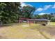 Lush backyard features a swing set and ample space for outdoor activities and entertainment, perfect for Gathering fun at 1753 Pounds Rd, Stone Mountain, GA 30087