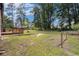 Expansive backyard features a wooden deck, mature trees, and plenty of space for outdoor activities, offering a private retreat at 1753 Pounds Rd, Stone Mountain, GA 30087