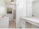 Bright bathroom featuring a vanity with seating and a separate toilet and shower area at 1753 Pounds Rd, Stone Mountain, GA 30087