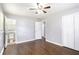Bright bedroom featuring hardwood floors, natural light, closet, and ensuite bathroom at 1753 Pounds Rd, Stone Mountain, GA 30087