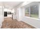 Open layout with view of kitchen, showcasing a window, dining area, and natural light at 1753 Pounds Rd, Stone Mountain, GA 30087