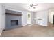 Cozy living room with painted brick fireplace and access to the backyard at 1753 Pounds Rd, Stone Mountain, GA 30087
