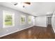 Bright living room with hardwood floors, neutral paint, and an abundance of natural light at 1753 Pounds Rd, Stone Mountain, GA 30087