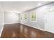 Bright living room with hardwood floors, neutral paint, and an abundance of natural light at 1753 Pounds Rd, Stone Mountain, GA 30087
