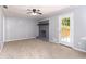 Cozy living room with painted brick fireplace and access to the backyard at 1753 Pounds Rd, Stone Mountain, GA 30087