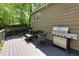 Well-maintained back deck with furniture and grill at 1760 Little Willeo Rd, Marietta, GA 30068