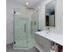 Bright bathroom with modern glass shower, white cabinets, and light stone counter at 1760 Little Willeo Rd, Marietta, GA 30068