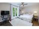 Bedroom with natural light, dark floors, desk, television, and white decor at 1760 Little Willeo Rd, Marietta, GA 30068