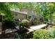 Spacious backyard featuring a tiered deck, a covered patio and mature trees at 1760 Little Willeo Rd, Marietta, GA 30068