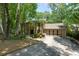 Inviting two-story home with an attached garage, mature trees, and landscaped front yard at 1760 Little Willeo Rd, Marietta, GA 30068