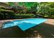Beautiful backyard pool with diving board and stairs with the home exterior as a backdrop at 1760 Little Willeo Rd, Marietta, GA 30068