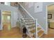 Elegant foyer featuring a staircase with wrought iron railings and hardwood floors at 1760 Little Willeo Rd, Marietta, GA 30068