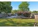 Wide shot of the backyard showcasing the patio, trees, and fenced-in perimeter at 1841 Thompson Ave, Atlanta, GA 30344