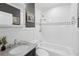 Updated bathroom with white subway tile and granite vanity at 1841 Thompson Ave, Atlanta, GA 30344