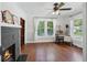 Bedroom featuring a black brick fireplace, desk and natural lighting at 1841 Thompson Ave, Atlanta, GA 30344