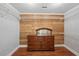 Dressing room with wood paneling, drawers, and shelving units at 1841 Thompson Ave, Atlanta, GA 30344