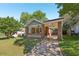 Charming brick home with a covered front porch and a well-maintained lawn at 1841 Thompson Ave, Atlanta, GA 30344