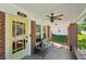 Inviting covered front porch with brick columns, seating, and a ceiling fan at 1841 Thompson Ave, Atlanta, GA 30344