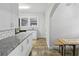 Clean kitchen featuring granite countertops, neutral cabinets, and tile floors at 1841 Thompson Ave, Atlanta, GA 30344