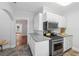 Kitchen with white cabinets, granite countertops and stainless steel oven at 1841 Thompson Ave, Atlanta, GA 30344