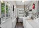Bright laundry room with a new washer and dryer and access to the backyard at 1841 Thompson Ave, Atlanta, GA 30344