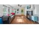 Bright living room with hardwood floors, fireplace, and a comfortable gray sofa at 1841 Thompson Ave, Atlanta, GA 30344