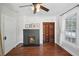 Charming living room featuring a brick fireplace and window with natural light at 1841 Thompson Ave, Atlanta, GA 30344