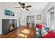 Bright living room featuring a fireplace, hardwood floors, and a comfortable sofa at 1841 Thompson Ave, Atlanta, GA 30344