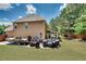 Spacious backyard with manicured lawn, storage for watercraft and multiple grills, perfect for outdoor living at 204 Arthur Hills Dr, Acworth, GA 30101