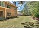 Picturesque backyard featuring green lawn, mature trees, and tidy landscaping, creating a serene outdoor setting at 204 Arthur Hills Dr, Acworth, GA 30101