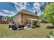 Well-maintained backyard with a mix of grass, landscaping, and a screened-in porch perfect for relaxation at 204 Arthur Hills Dr, Acworth, GA 30101