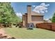 Well-maintained backyard with green lawn and a trampoline, perfect for outdoor activities at 204 Arthur Hills Dr, Acworth, GA 30101