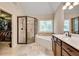 Bathroom features a double sink vanity, glass enclosed shower and walk-in closet at 204 Arthur Hills Dr, Acworth, GA 30101