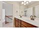 Bathroom with double sink vanity, quartz countertop, and bronze fixtures at 204 Arthur Hills Dr, Acworth, GA 30101