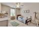 Cozy bedroom with neutral walls, ceiling fan and a wooden bed frame at 204 Arthur Hills Dr, Acworth, GA 30101