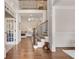Elegant foyer with hardwood floors, a staircase with iron railings, and wainscoting details at 204 Arthur Hills Dr, Acworth, GA 30101