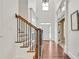 Grand foyer featuring hardwood floors, a staircase with dark iron spindles, and tall ceilings at 204 Arthur Hills Dr, Acworth, GA 30101