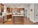 Kitchen featuring stainless appliances, dark cabinetry, granite countertops, and hardwood floors at 204 Arthur Hills Dr, Acworth, GA 30101