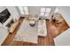 Bright and airy living room with fireplace, hardwood floors, and comfortable seating arrangement at 204 Arthur Hills Dr, Acworth, GA 30101