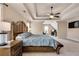 Spacious main bedroom with attached bonus room, TV and ceiling fan at 204 Arthur Hills Dr, Acworth, GA 30101