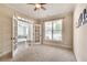 Inviting office space with neutral carpet, ceiling fan, and French doors leading to another room at 204 Arthur Hills Dr, Acworth, GA 30101
